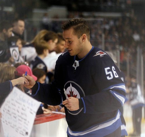 PHIL HOSSACK / WINNIPEG FREE PRESS - Marko Dano takes a moment out to sign autographs for young fans Wedneday at Bell MTS Place as the Jets showed off their skills for fans in the annual Skills Competition.  See story. February 13, 2018