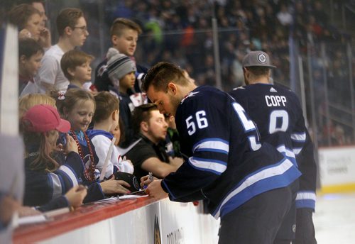 PHIL HOSSACK / WINNIPEG FREE PRESS - Marko Dano takes a moment out to sign autographs for young fans Wedneday at Bell MTS Place as the Jets showed off their skills for fans in the annual Skills Competition.  See story. February 13, 2018