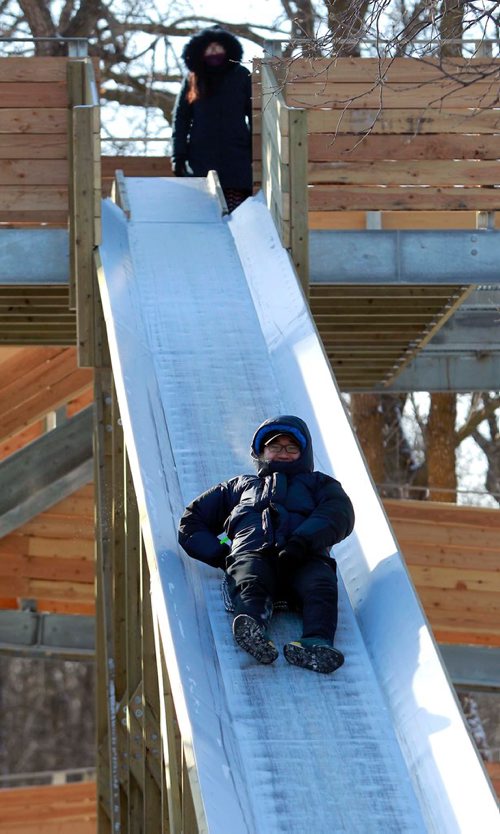 BORIS MINKEVICH / WINNIPEG FREE PRESS
Cae Lee enjoys the new toboggan slides at St. Vital Park. He was there with his friend (who didn't want name used). He moved to near Brandon, MB 2 years ago from South Korea and embraces the cold Winnipeg temps. Feb. 15, 2018