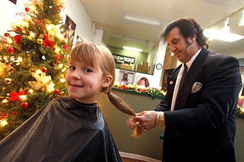 BORIS MINKEVICH / WINNIPEG FREE PRESS  081119 Ashley Prest's daughter Maslen Lunney ,6, got her long hair chopped off for charity. The new hairstyle was cut by Jim Marles from Authentique Studio 3 hair salon on Red River Blvd. near Main Street. Her long hair is to be donated to a wig maker that helps cancer patients that can't afford wigs.
