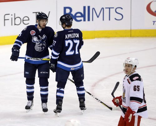 TREVOR HAGAN / WINNIPEG FREE PRESS
Manitoba Moose Cameron Schilling (5) gives instructions to Mason Appleton (27) during a stop in play against the Grand Rapids Griffins during the first period of AHL hockey action, Thursday, February 15, 2018.