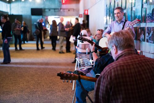 MIKAELA MACKENZIE / WINNIPEG FREE PRESS
Guitarists jam and wait in the lobby before Once musical cast members lead guitarists, singers, and other musicians in a large group rendition of "Falling Slowly" at the Royal Manitoba Theatre Centre in Winnipeg, Manitoba on Friday, Feb. 16, 2018. 
180216 - Friday, February 16, 2018.
