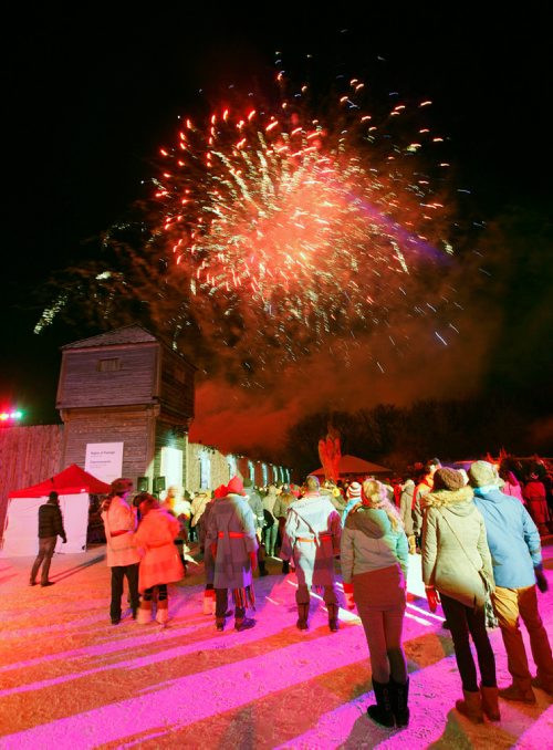 PHIL HOSSACK / Winnipeg Free Press - Festival du Voyageur fans watch the fireworks exploding over Fort Gibralter Friday evening as the Festival opened it's 49th year. -  February 16, 2018