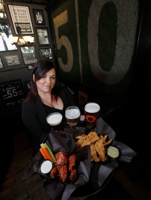 PHIL HOSSACK / Winnipeg Free Press - Meissa Ross shows off  Chicken Fingers and Honey Dill along with Wings at  "The Pint" underneath the 50 Yard line fromthe old stadium.. See Dave Sanderson's "Intersection" piece. -  February 16, 2018