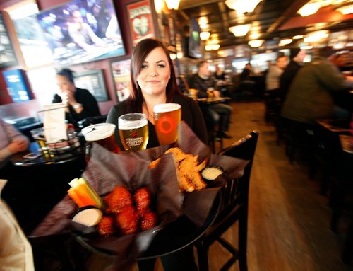 PHIL HOSSACK / Winnipeg Free Press - Meissa Ross serves up  Chicken Fingers and Honey Dill along with Wings at  "The Pint" underneath the 50 Yard line fromthe old stadium.. See Dave Sanderson's "Intersection" piece. -  February 16, 2018