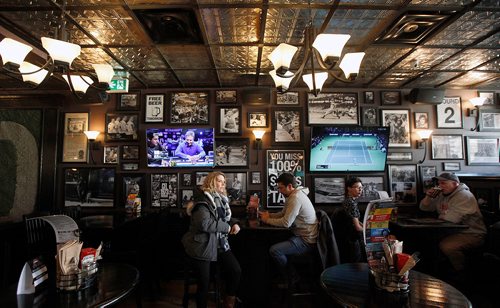 PHIL HOSSACK / Winnipeg Free Press - Sports action photos and TV monitors square a wall at "The Pint" underneath Antique metal ceilings. See Dave Sanderson's "Intersection" piece. -  February 16, 2018
