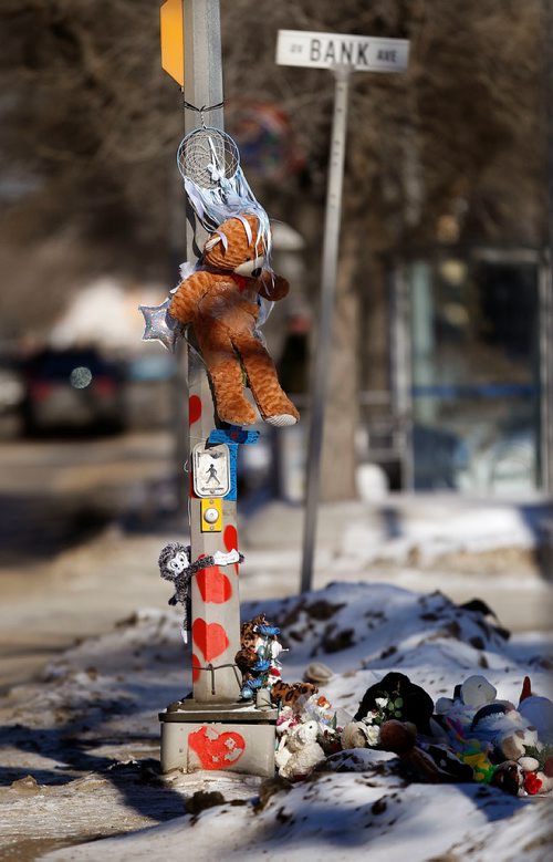 PHIL HOSSACK / WINNIPEG FREE PRESS - A cairn of thoughts prayers and toys grows at the crosswalk scene of an accident that killed 8 yr old Surafel last tuesday. See Redekop story.- February 17, 2018