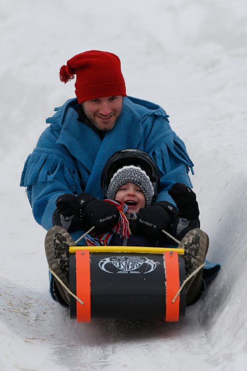 JOHN WOODS / WINNIPEG FREE PRESS
Pierre Dupuis and son Erik slide at the Festival du Voyageur in Winnipeg Sunday, February 18, 2017.