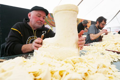 JOHN WOODS / WINNIPEG FREE PRESS
Lyle Peters (L) from Steinbach and Neil Fogg carve cheese in a cheese carving competition at the Festival du Voyageur in Winnipeg Sunday, February 18, 2017.