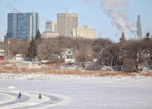 TREVOR HAGAN / WINNIPEG FRESS
Person skating on the river trail with downtown and the CMHR in the background, Monday, February 19, 2018.