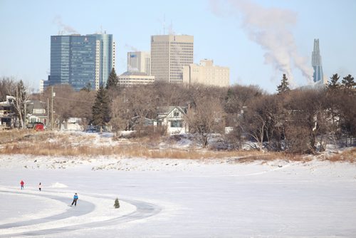 TREVOR HAGAN / WINNIPEG FRESS
People skating on the river trail with downtown and the CMHR in the background, Monday, February 19, 2018.