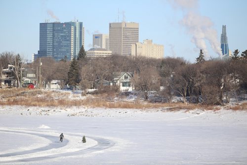 TREVOR HAGAN / WINNIPEG FRESS
Person skating on the river trail with downtown and the CMHR in the background, Monday, February 19, 2018.