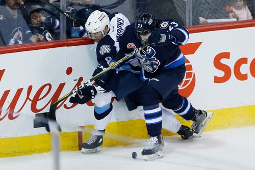 JOHN WOODS / WINNIPEG FREE PRESS
Manitoba Moose Michael Spacek (23) checks Milwaukee Admirals' Trevor Murphy (28) during second period AHL action in Winnipeg on Monday, February 19, 2018.