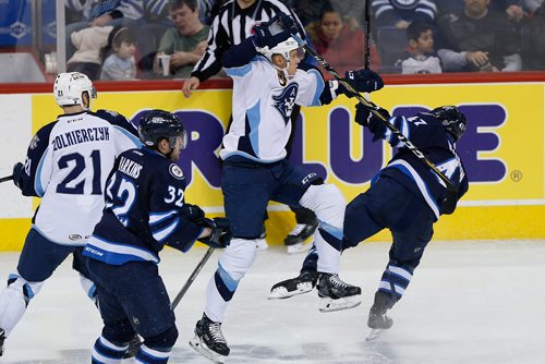 JOHN WOODS / WINNIPEG FREE PRESS
Manitoba Moose Charles-David Beaudoin (47) gets checked by Milwaukee Admirals' Joonas Lyytinen (75) during second period AHL action in Winnipeg on Monday, February 19, 2018.