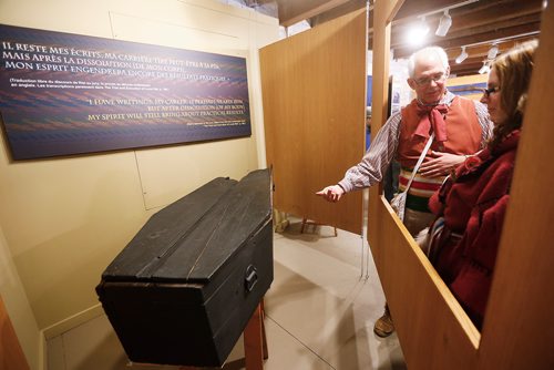 JOHN WOODS / WINNIPEG FREE PRESS
Philippe Mailhot, former director of the St. Boniface Museum, shows Michelle Sorin Louis Riel's coffin and memorabilia during a tour to at the St Boniface Museum in Winnipeg Monday, February 19, 2018. In honour of Louis Riel Day, the Manitoba Metis Federation and Le Musee de Saint-Boniface will be hosting a free Louis Rield Day Celebration.