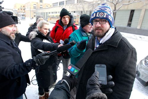 BORIS MINKEVICH / WINNIPEG FREE PRESS
TappCar made a major announcement today across from Winnipeg City Hall today. City councillor Matt Allard, right, at the event. They had a car there with the logo on it. Feb. 20, 2018