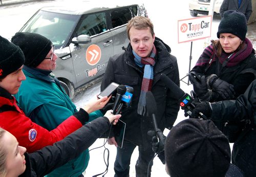 BORIS MINKEVICH / WINNIPEG FREE PRESS
TappCar made a major announcement today across from Winnipeg City Hall today. Pascal Ryffel, centre, spoke at the event. They had a car there with the logo on it. Feb. 20, 2018