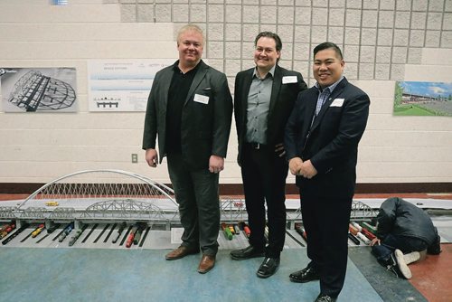 Canstar Community News Feb. 8, 2018 - Pictured left to right: City of Winnipegs bridge planning and operations engineer Darren Burmey, Stantecs project team member Mike Boissonneault and Point Douglas councilor Mike Pagtakhan in front of the scaled model of the new Arlington Bridge at an open house held at the North Centennial Recreational and Leisure Centre. (LIGIA BRAIDOTTI/CANSTAR/TIMES)