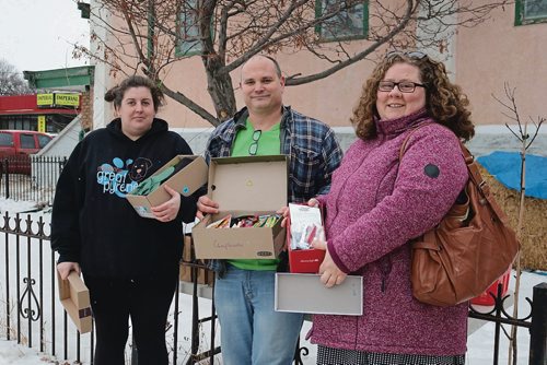 Canstar Community News Feb. 14, 2018 - Volunteers with the Fountain Street Community Cupboard Andrea Vaile, Kelly Hughes and Carrie Foden, prepared and handed out boxes with gifts for those in need. (LIGIA BRAIDOTTI/CANSTAR/TIMES)