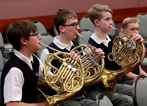 BORIS MINKEVICH / WINNIPEG FREE PRESS
The Westgate Mennonite Collegiate grade 9 band warms up before their afternoon performance at the RBC Convention Centre. Three french horn players, from left, Jonah Bergen, Nathan Abercrombie, and Nicholas Klassen hold a perfect pitch in the warmup. The Festival Started Tuesday and runs til March 3rd. School concert and jazz bands from all over Manitoba are participating in the 43rd Annual Optimist International Band Festival. STANDUP PHOTO. Feb. 21, 2018