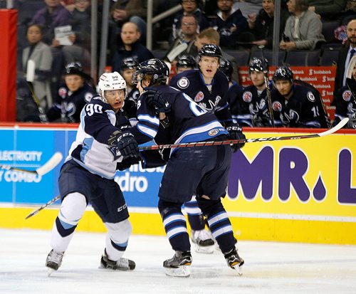 PHIL HOSSACK / WINNIPEG FREE PRESS - Manitoba Moose #8 Sami Niku ties up Milwaukee Admiral #90 Anthony Richard at the Moose blue line Wednesday evening at the Bell Mts Centre. - February 21, 2018