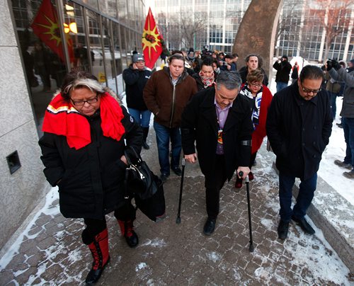 PHIL HOSSACK / WINNIPEG FREE PRESS -Derrick Henderson, Chief of Sagkeeng First Nation (on crutches) leads a procession of chiefs away from the Winnipeg Courthouse Thursday after Raymond Cormier was found not guilty in the murder of Tina Fontaine. See story.  - February 22, 2018