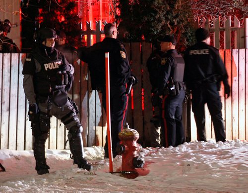 PHIL HOSSACK / WINNIPEG FREE PRESS - Tackical Team members outside a house on Aberdeen between Salter and Aikens Thursday evening. At least one man was taken into custody. No idea what happened but a large police presence including ambulances.  - February 22, 2018