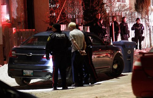 PHIL HOSSACK / WINNIPEG FREE PRESS - Police take a man into custody outside a house on Aberdeen between Salter and Aikens Thursday evening. At least one man was taken into custody. No idea what happened but a large police presence including ambulances.  - February 22, 2018
