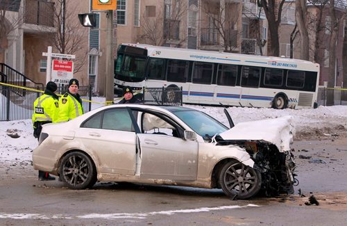 BORIS MINKEVICH / WINNIPEG FREE PRESS
A car vs. Winnipeg Transit bus MVC scene on Goulet Street at Traverse Ave. Crash. Motor vehicle accident. Police. Feb. 23, 2018