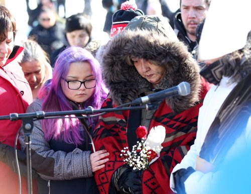 RUTH BONNEVILLE / WINNIPEG FREE PRESS

Thelma Favel, Tina Fontaine's  great aunt, embraces her niece, Melena Bittern, while holding a red carnation and eagle feather at the centre of the Oodena Circle during rally for Tina at the Forks Friday. 
Hundreds of people march from the Law Courts to the the Forks holding signs  in support of Tina Fontaine's family members after a not guilty verdict was issued to Tina's accused killer, Raymond Cormier, Thursday.  

February 23, 2018

