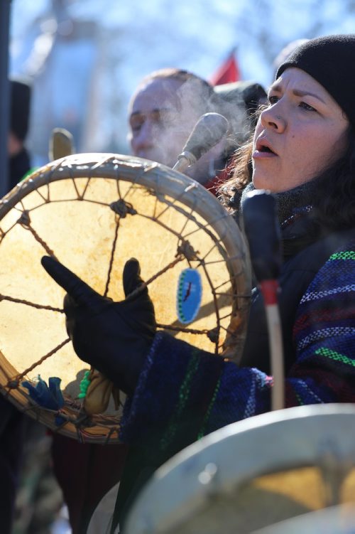 RUTH BONNEVILLE / WINNIPEG FREE PRESS

Traditional drummers sing at the centre of the Oodena Circle with family during rally for Tina at the Forks Friday.  Hundreds of people march from the Law Courts to the the Forks holding signs  in support of Tina Fontaine's family members after a not guilty verdict was issued to Tina's accused killer, Raymond Cormier, Thursday.  

February 23, 2018