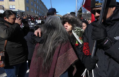 RUTH BONNEVILLE / WINNIPEG FREE PRESS

Thelma Favel, Tina Fontaine's great aunt,  is embraced by supporters as she is escorted back out of the Oodena Circle at the end of rally for Tina at the Forks Friday.  Hundreds of people march from the Law Courts to the the Forks holding signs  in support of Tina Fontaine's family members after a not guilty verdict was issued to Tina's accused killer, Raymond Cormier, Thursday.  

February 23, 2018