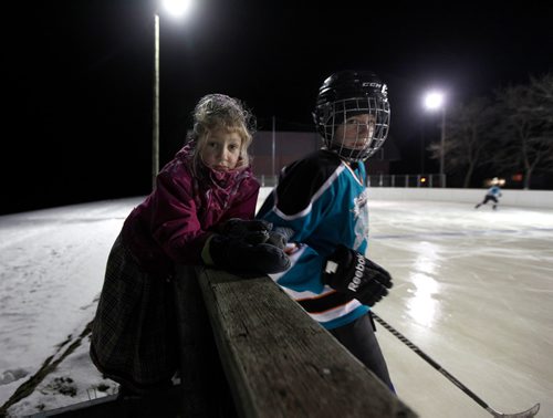 PHIL HOSSACK / WINNIPEG FREE PRESS - Alexa Maendel sticks close as her brother Colin Maendel 14 practices on the Baker Colony ice rink. -See Melissa Martin's story.  - February 23, 2018