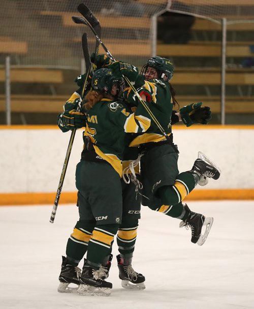 TREVOR HAGAN / WINNIPEG FREE PRESS
Alberta Pandas,  Cayle Dillon (5), Taylor Kezama (4) and Autumn MacDougall (9) celebrate after Kezama scored against the Manitoba Bisons, Friday, February 23, 2018.