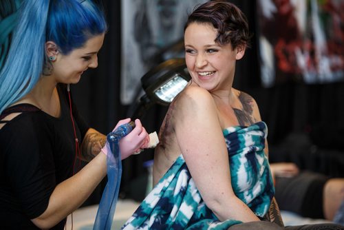 MIKE DEAL / WINNIPEG FREE PRESS
Nicole Roy gets a tattoo by Kalei Jaworski during The Winnipeg Tattoo Show at the convention centre Saturday.
180224 - Saturday, February 24, 2018.