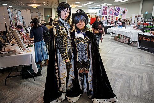 MIKE DEAL / WINNIPEG FREE PRESS

Kaitlin Pacheco (left), 19, as Sebastian Michaelis and Bianca Pabalan (right), 19, as Ciel Phantomhive at Ai-Kon&#x2019;s Winterfest. Gamers, cosplayers and fans of all manners of Japanese culture showed up at the convention centre on Saturday for Ai-Kon&#x2019;s seventh Winterfest.

180224 - Saturday, February 24, 2018.
