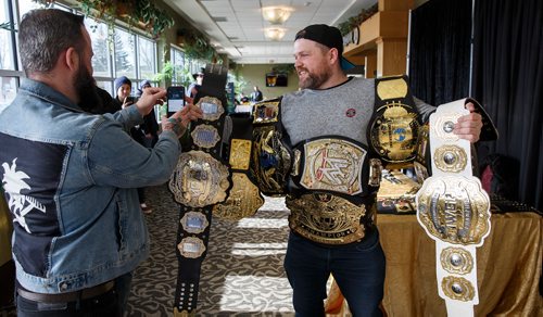 MIKE DEAL / WINNIPEG FREE PRESS
Ryan Pearson is draped in wrestling belts for a photo during the CWE's Legends Of Wrestling & Professional Sports Convention 2 held at the Canad Inns Garden City on Saturday.
180224 - Saturday, February 24, 2018.