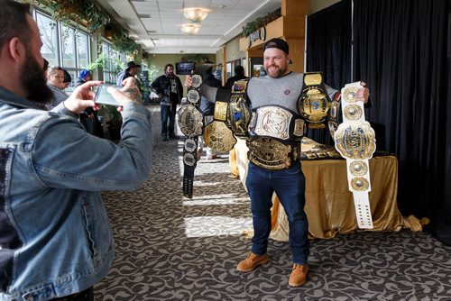 MIKE DEAL / WINNIPEG FREE PRESS
Ryan Pearson is draped in wrestling belts for a photo during the CWE's Legends Of Wrestling & Professional Sports Convention 2 held at the Canad Inns Garden City on Saturday.
180224 - Saturday, February 24, 2018.