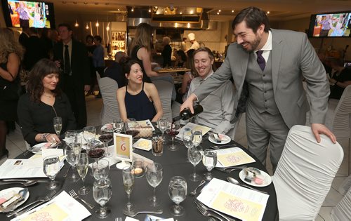 JASON HALSTEAD / WINNIPEG FREE PRESS

Stephen Chesnut (right) pours wine for fellow RBC staff, LeeAnne Chesnut (left), Jacinthe Sacher and Iain McMaster at their table at the Deer Lodge Foundations Bella Notte fundraising dinner on Feb. 9, 2018 at De Luca's Banquet Centre. (See Social Page)