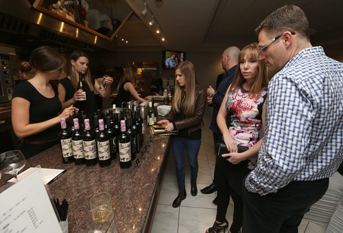 JASON HALSTEAD / WINNIPEG FREE PRESS

Attendees check out the wine selection at the Deer Lodge Foundations Bella Notte fundraising dinner on Feb. 9, 2018 at De Luca's Banquet Centre. (See Social Page)