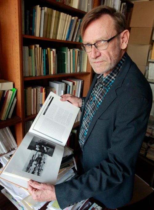BORIS MINKEVICH / WINNIPEG FREE PRESS
Royden Loewen Chair in Mennonite Studies University of Winnipeg poses for a photo in his office. Here he looks at a book done on the Ukranian Mennonites. A fellowship has been struck to access the recently opened KGB archives in Ukraine. The fellowship will be researching records of the more than 30,000 Mennonites who went missing during the Stalin's reign of terror. BILL REDEKOP STORY. Feb. 26, 2018