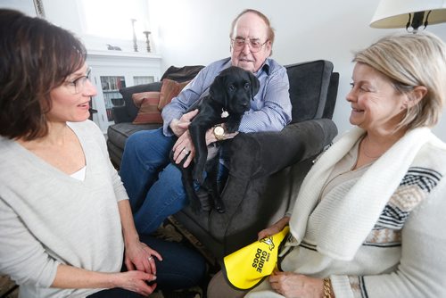 JOHN WOODS / WINNIPEG FREE PRESS
Jim Gauthier holds Joycie, future guide dog, as her foster mom Lorraine Rempel, left, and Canadian National Institute for the Blind (CNIB) rep Margot Ross looks on in Rempel's home Monday, February 26, 2018. Joycie, who is named after Gauthier's late wife, arrived in Canada last week from a breeder in Australia, along with her sister Lulu. The two pups are the first guide dogs the CNIB will train here in Winnipeg with Gauthier's financial support. 

