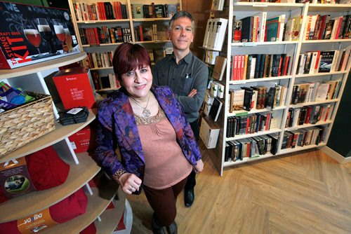 PHIL HOSSACK / WINNIPEG FREE PRESS - Chris Hall and partner Lori Baker (left)  pose at the new McNally Robinson Bookstore location at the Forks. Martin Cash story. - February 26, 2018