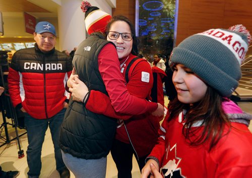 JOHN WOODS / WINNIPEG FREE PRESS
As her father Terrence looks on Brigette Lacquette of Mallard, silver in hockey, gets hugs from fans as she arrives home from the winter olympics Monday, February 26, 2018.