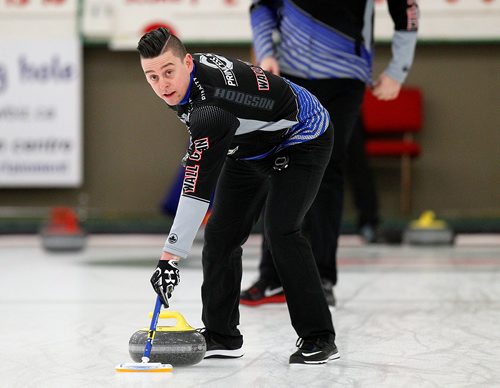 PHIL HOSSACK / WINNIPEG FREE PRESS -  TEAM CARRUTHERS - Carruthers lead, Colin Hodgson sweeps down ice during a practice session at the Granit CC Tuesday afternoon. See Jay Bell's story.  - February 27, 2018