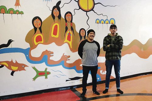 Canstar Community News Feb. 20, 2018 - From left to right: Graffiti Art Programming director Pat Lazo and Manitoba artist Jordan Stranger will be co-creating a mural for one of the exterior walls of the Indigenous Family Centre building that will be inspired by the existing Jackson Beardy painting. (LIGIA BRAIDOTTI/CANSTAR/TIMES)