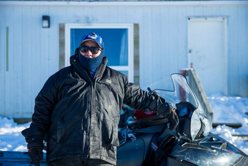 MIKAELA MACKENZIE / WINNIPEG FREE PRESS
Norris Thomas poses for a portrait before heading out on his snowmobile on the Chemawawin Reserve, Manitoba on Friday, Feb. 23, 2018. 
180223 - Friday, February 23, 2018.