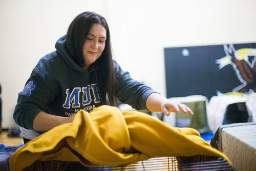 MIKAELA MACKENZIE / WINNIPEG FREE PRESS
Manitoba Underdogs volunteer Jasmyn Monkan sets up blankets and kennels in the school gym for the spay and neuter clinic on the Chemawawin First Nation Reserve, Manitoba on Saturday, Feb. 24, 2018. Many Northern Manitoban communities have problems with stray dog overpopulation, and initiatives like these aim to reduce their numbers in a humane way while increasing the quality of life for dogs and humans.
180224 - Saturday, February 24, 2018.