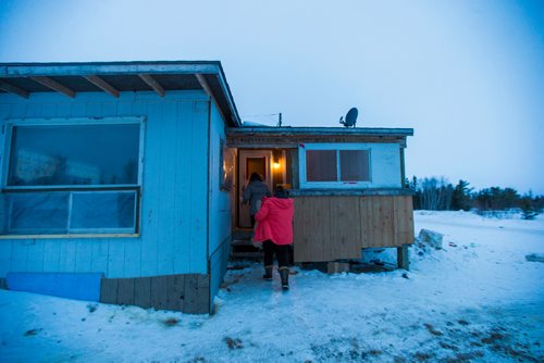 MIKAELA MACKENZIE / WINNIPEG FREE PRESS
Manitoba Underdogs volunteers Jessica Hansen and Mychal Nemetchuk drop off a fixed dog to a community member on the Chemawawin First Nation Reserve, Manitoba on Saturday, Feb. 24, 2018. Many Northern Manitoban communities have problems with stray dog overpopulation, and initiatives like these aim to reduce their numbers in a humane way while increasing the quality of life for dogs and humans.
180224 - Saturday, February 24, 2018.