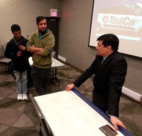 BORIS MINKEVICH / WINNIPEG FREE PRESS
Edmonton-based ridesharing company TappCar had a driver-training session at the Holiday Inn South in Winnipeg. Balraj Manhas, right, ran the session. RYAN THORPE STORY. March 1, 2018